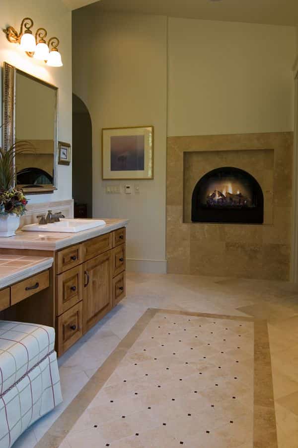 Awbrey Butte custom home with fireplace in master bathroom